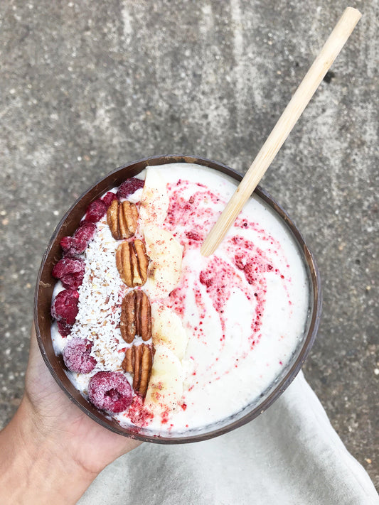 Berry Yoghurt with bamboo straw in a coconut bowl!